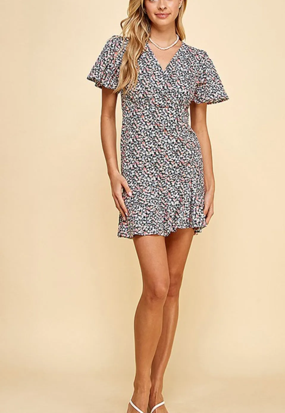 Floral mini dress with ruffle sleeves and hem